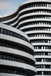 Low angle view of modern building against sky in city