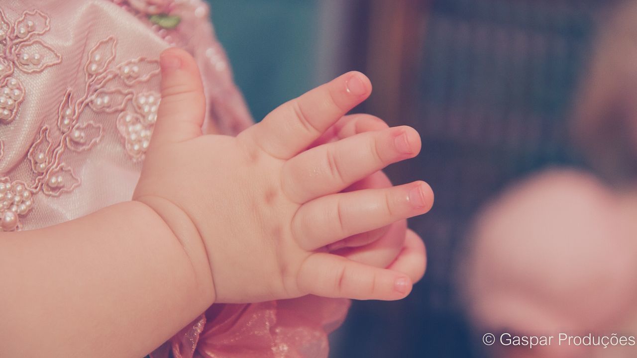 person, part of, lifestyles, indoors, close-up, human finger, love, bonding, cropped, leisure activity, togetherness, focus on foreground, holding, midsection, unknown gender