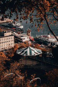 High angle view of trees and buildings in city