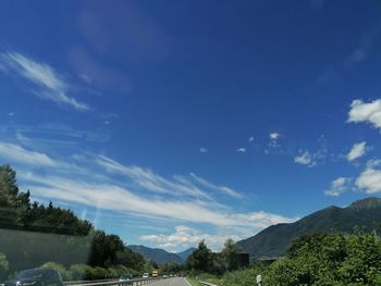 Scenic view of mountains against blue sky
