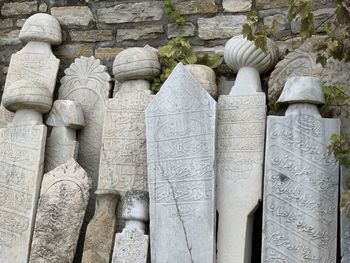 Close-up of ancient tombstone in fort cesme turkey