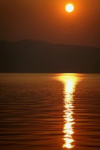 Scenic view of calm sea at sunset