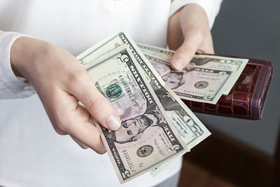 Close-up of a hand holding paper