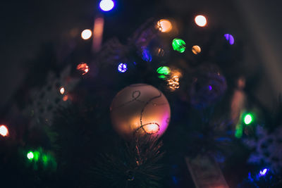 Low angle view of illuminated christmas tree at night