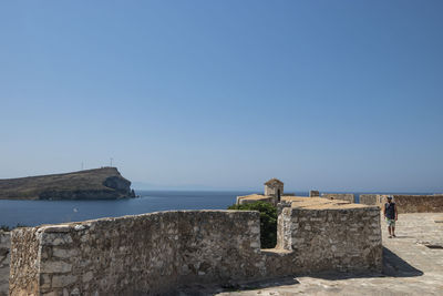 Scenic view of sea against clear blue sky