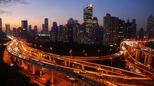 High angle view of light trails on road at night