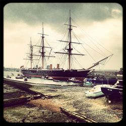 Boats moored at harbor