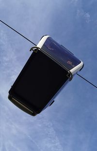 Low angle view of street light against sky