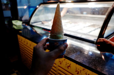 Person holding ice cream cone
