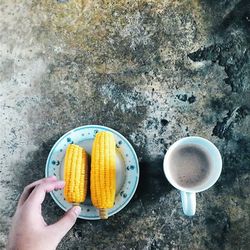 Cropped hand holding coffee