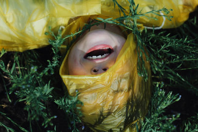 High angle view of child wearing raincoat