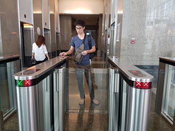 Man standing at turnstile