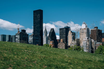 Buildings in city against sky