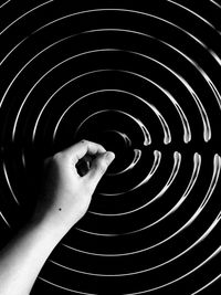 Person with arms raised in background