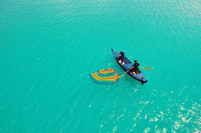 High angle view of people on boat in sea