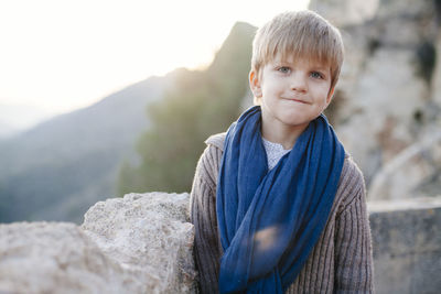 Portrait of boy standing outdoors