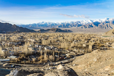 High angle view of snowcapped mountains against sky