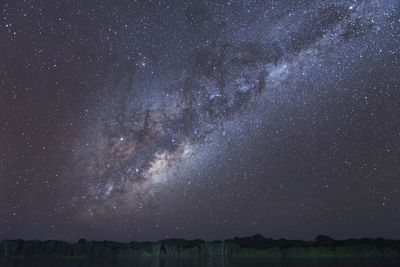 Scenic view of star field against sky at night