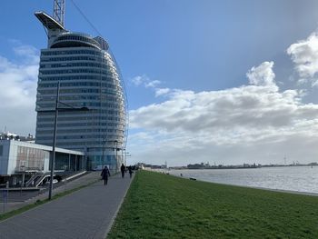 Modern building against cloudy sky