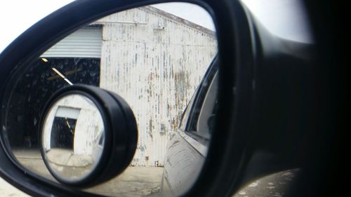 Reflection of car on side-view mirror