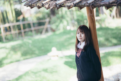 Portrait of woman standing outdoors