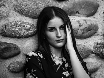 Portrait of young woman on rock