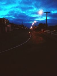 Road against cloudy sky at dusk