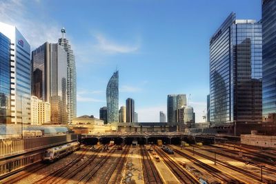 Modern buildings in city against sky