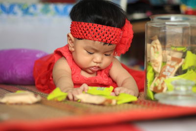 Midsection of cute girl with chocolate on table