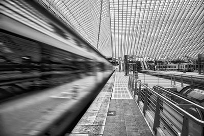 Blurred motion of train at railroad station