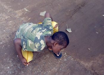 High angle view of cute boy lying down