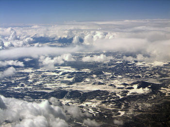 Aerial view of landscape against sky during winter