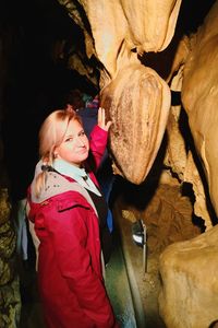 Portrait of woman standing in cave