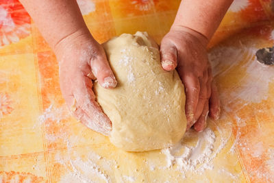 Cropped hand of person holding bread