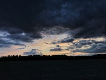 Scenic view of dramatic sky over land