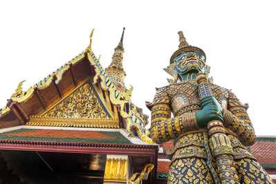 Low angle view of statue of temple against building