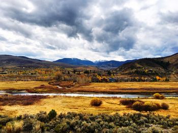 Scenic view of mountains against cloudy sky