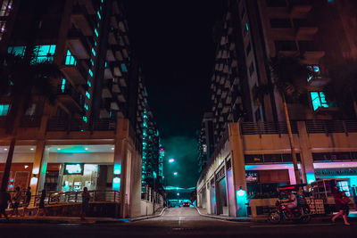 Low angle view of illuminated buildings at night