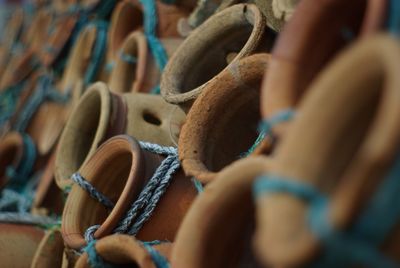 Full frame shot of tied pots for sale at workshop