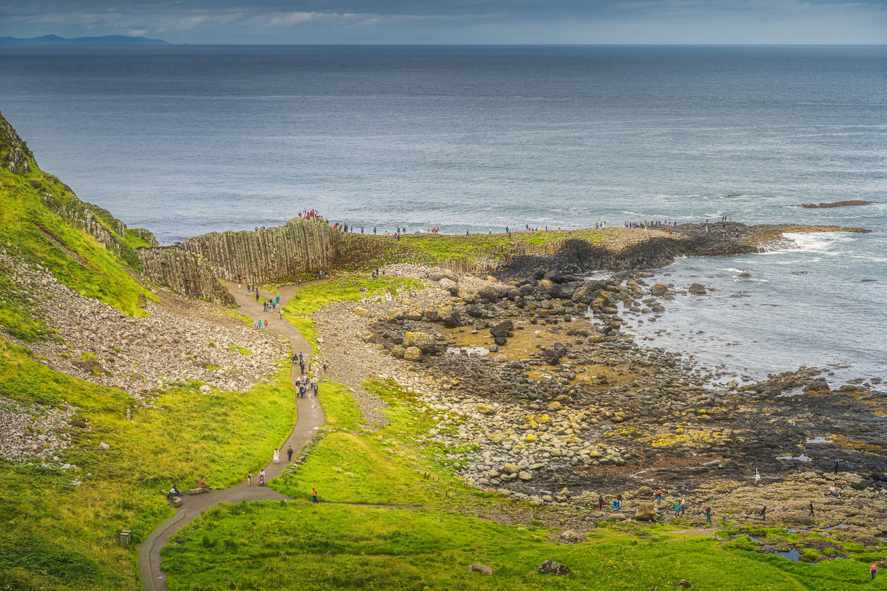 HIGH ANGLE VIEW OF ROAD BY SEA