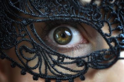 Close-up portrait of woman wearing mask