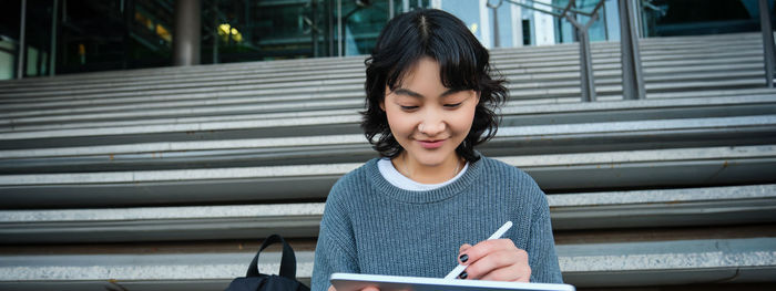 Young woman using mobile phone