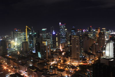 High angle view of illuminated buildings in city at night