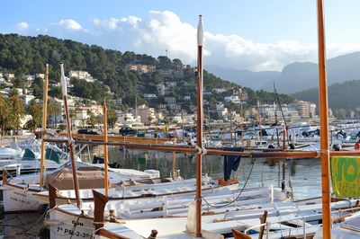 Boats moored at harbor