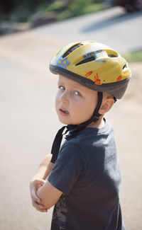 Portrait of boy standing on road