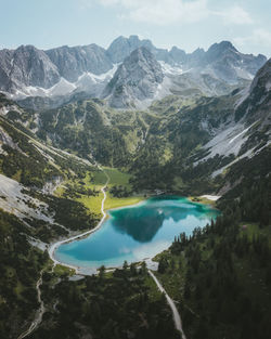 Scenic view of lake and mountains against sky