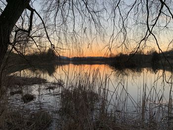 Scenic view of lake against sky during sunset