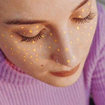 Close-up of eyes closed woman with face paint