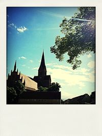 Low angle view of church against blue sky