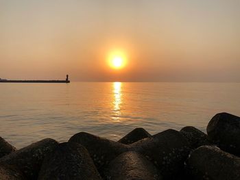 Scenic view of sea against sky during sunset